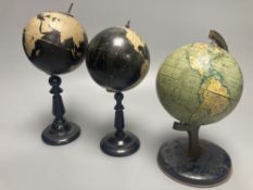 A Reliable Series lithographed tinplate revolving globe, 20cm, and two graphic globes,on ebonised