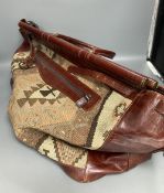 A Kelim Art, Turkey leather and needlework holdall, width 52cm