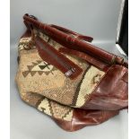 A Kelim Art, Turkey leather and needlework holdall, width 52cm