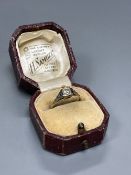 An early 20th century 18ct and solitaire diamond ring, size M/N, gross 2.3 grams.CONDITION: