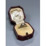 An early 20th century 18ct and solitaire diamond ring, size M/N, gross 2.3 grams.CONDITION: