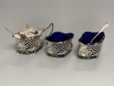 An Edwardian pierced silver three piece quatrefoil condiment set by William Oliver, Birmingham,