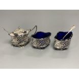 An Edwardian pierced silver three piece quatrefoil condiment set by William Oliver, Birmingham,