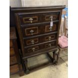 An 18th century style linenfold moulded oak and walnut chest on stand, width 73cm, depth 55cm,