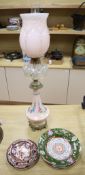 An ormolu mounted bone china oil lamp, height overall 80cm, an ironstone dessert dish and other