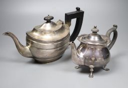 A George V silver London shape teapot and an earlier small circular form teapot with shaped rim,