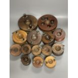 A collection of mahogany and brass fishing reels, largest 17.5cm (14)