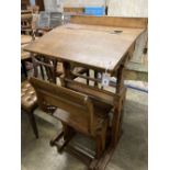 A 19th century Continental oak metamorphic rise and fall student's desk together with a matching