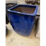 A large blue glazed square garden planter, width 63cm height 90cm