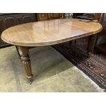 A Victorian mahogany oval extending dining table, with two spare leaves, 220cm extended, width