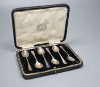 A set of six George V silver coffee spoons with shell terminals, by Thomas Bradbury & Sons, cased.