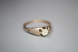 An Edwardian gold claw set solitaire diamond ring