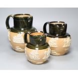 A graduated set of three Victorian Royal Doulton earthenware harvest jugs, tallest 19cm