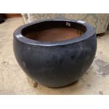 A circular grey glazed garden planter, diameter 43cm height 33cm