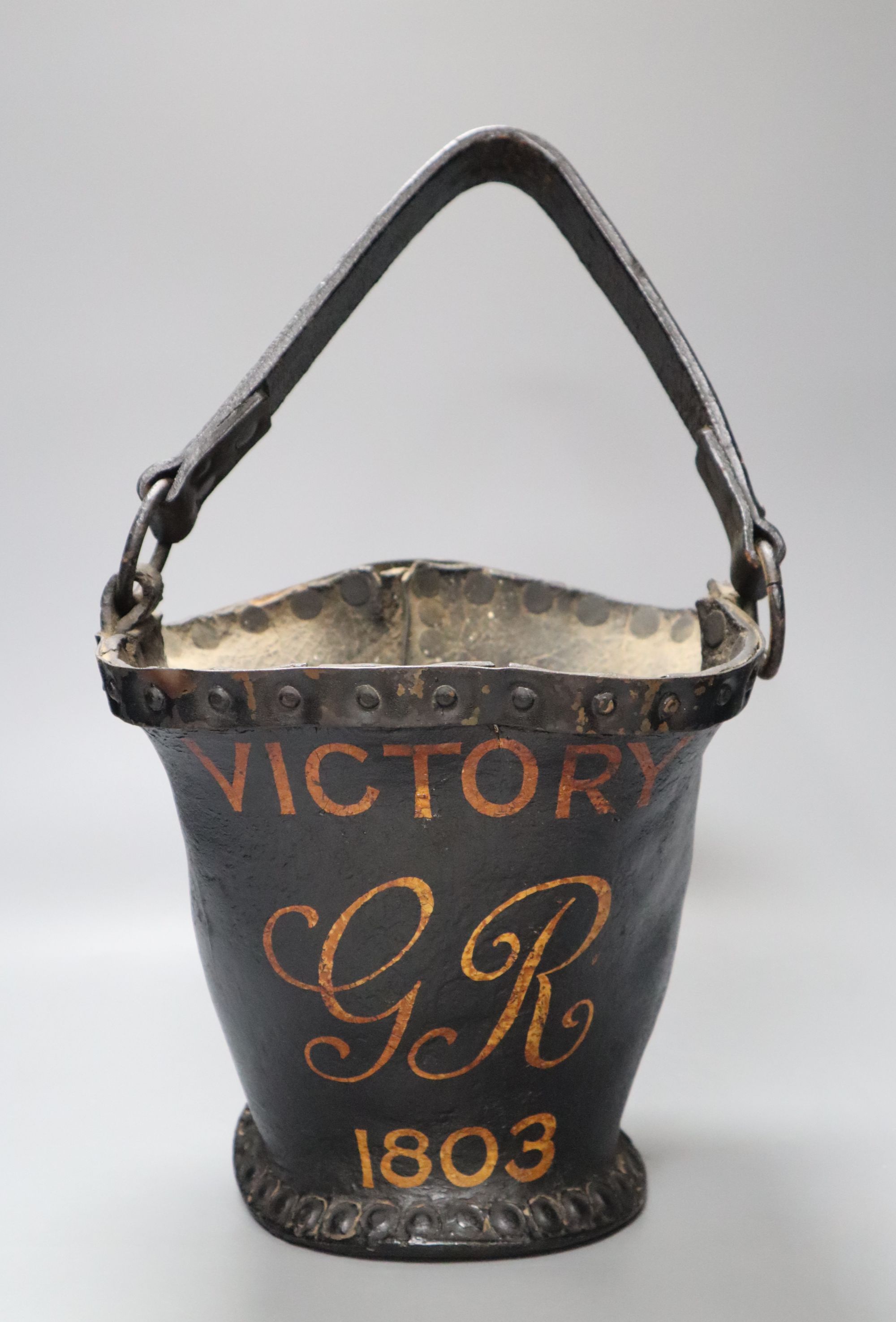 A leather fire bucket, inscribed 'Victory-GR-1803', height 21cmCONDITION: 19th century bucket with