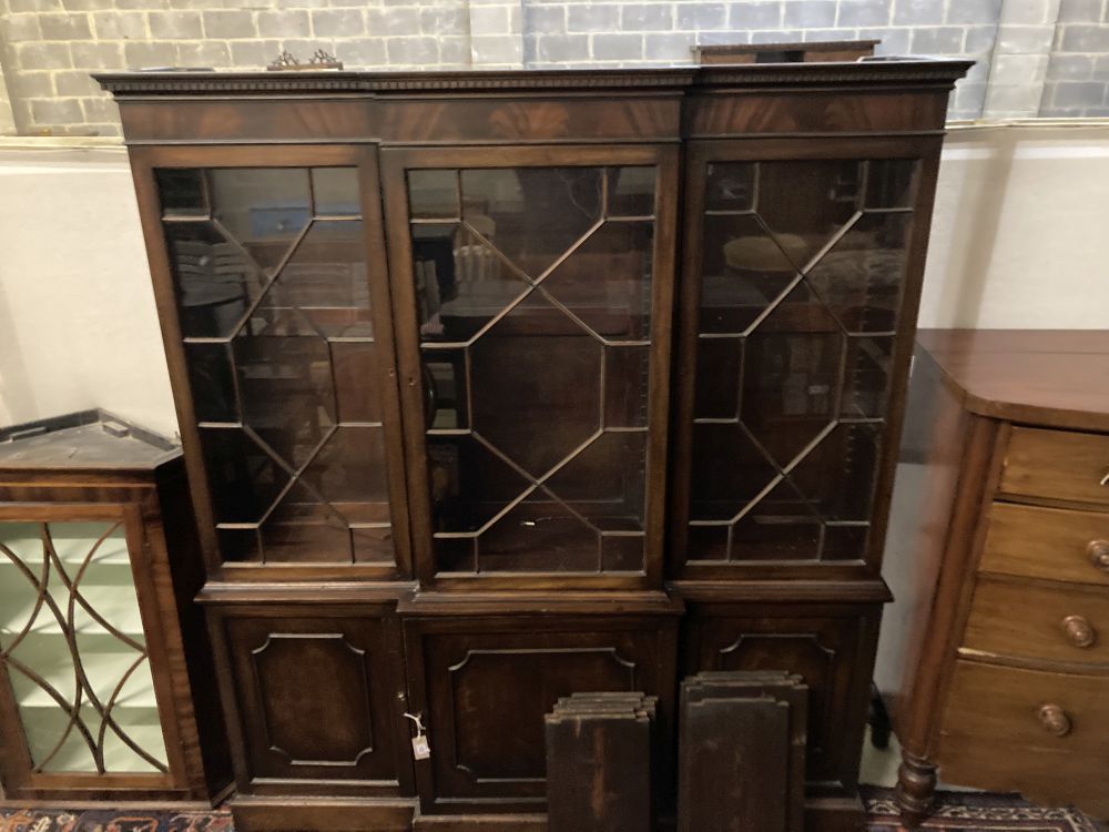 A reproduction George III-style mahogany breakfront library bookcase, width 172cm, depth 40cm,