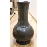 A 17th/18th century Chinese bronze baluster vase, height 65cm (holed)