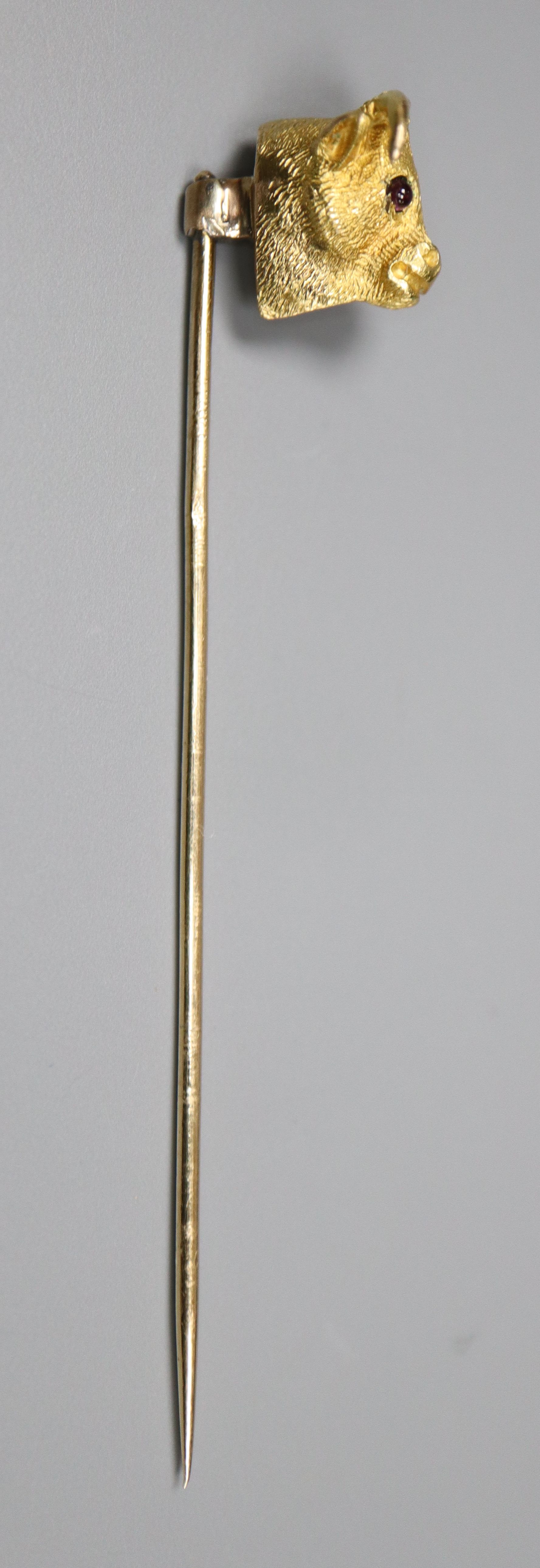 An Edwardian yellow metal and garnet set 'bull's head' stick pin, 65mm, gross 4.4 grams.CONDITION: - Image 3 of 3