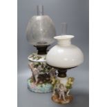 A Sitzendorf porcelain oil lamp and another similar smaller oil lamp, tallest 54cm including