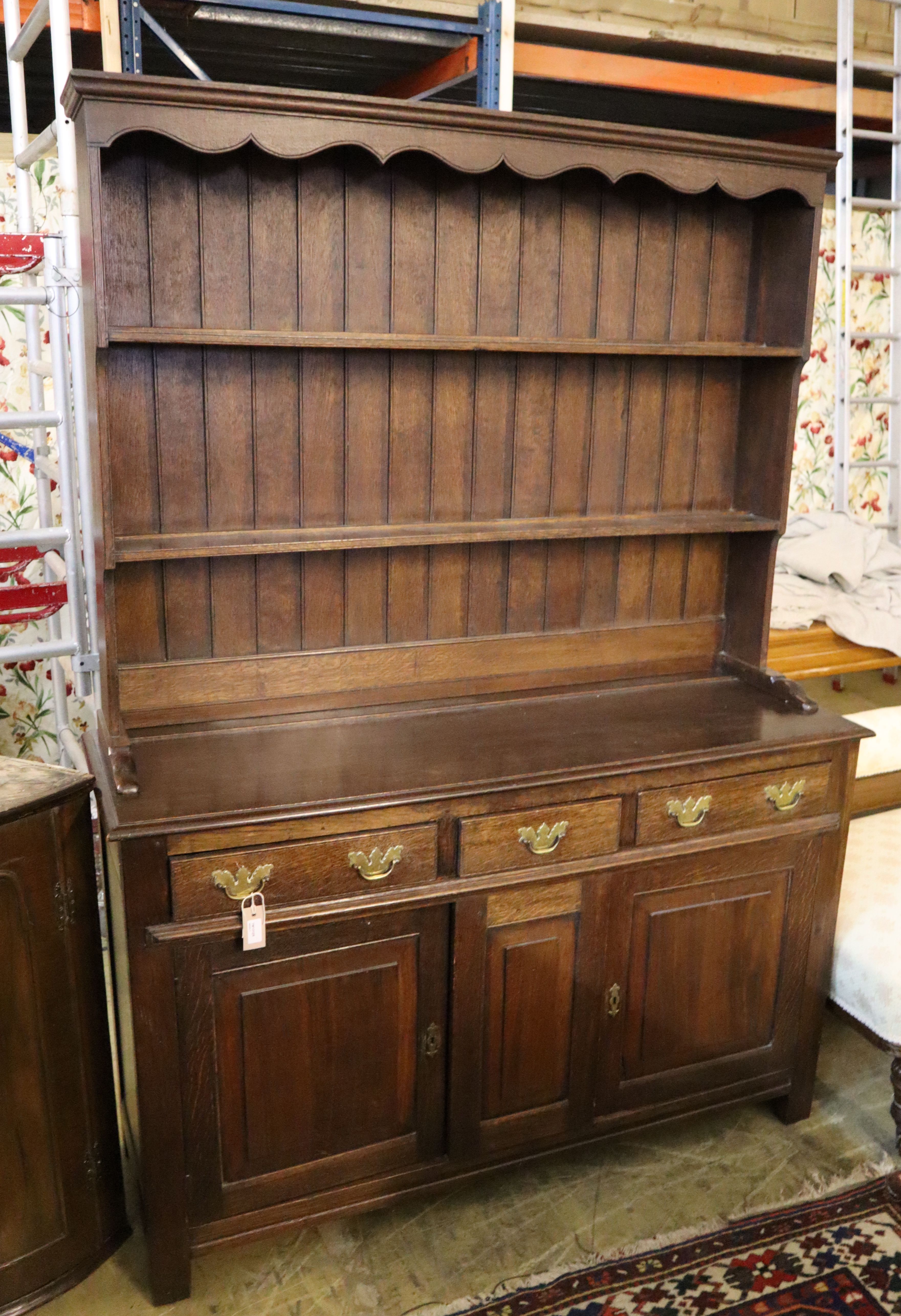 A George III style oak dresser, width 138cm, depth 45cm, height 190cm