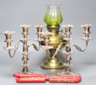 A pair of plated two branch candelabra and a brass oil lamp (3)