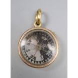 An 18ct cased pendant compass, with bale, 22mm, gross 14 grams.CONDITION: Bale only stamped 18ct.