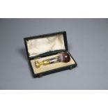 A Victorian gold mounted agate desk seal, with paper label '... given by Queen V...', 8cm, cased (