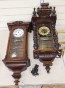 A walnut Vienna regulator with enamelled Roman dial and another regulator with carved pediment,