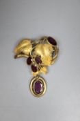 A Victorian garnet and pinchbeck fruiting scroll brooch, 5.75cm