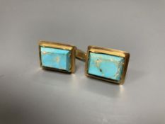 A pair of yellow metal and turquoise set rectangular cufflinks, 20mm, gross 15.8 grams.CONDITION: