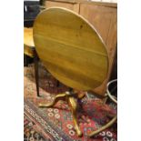 A George III oak circular tilt-top occasional table, diameter 80cm, height 74cm