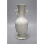 A Chinese white glazed porcelain two handled vase, height 29cm (a.f.)CONDITION: Base section has