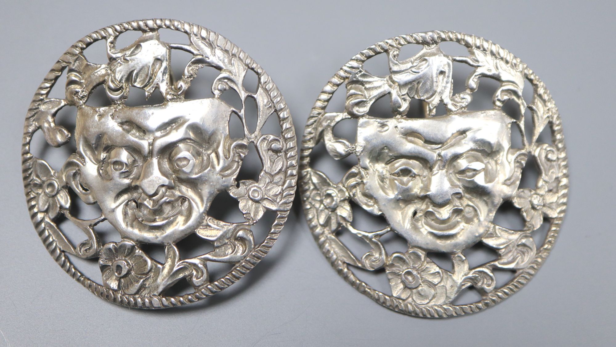A pair of continental pierced white metal foliate and mask concave circular earrings, 38mm, gross