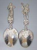 An ornate pair of late Victorian Hanau silver servers with figural handles, modelled as a lady and