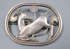 A 1960's Georg Jensen silver kneeling deer oval brooch, no. 256, designed by Arno Malinowski, 45mm.