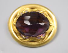 A Victorian pinchbeck and facetted amethyst paste set oval brooch, 37mm.