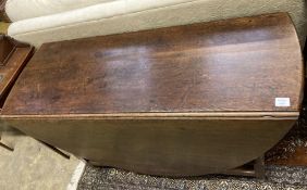 An 18th century oak oval topped gateleg dining table, fitted single drawer, width 130cm depth 50cm