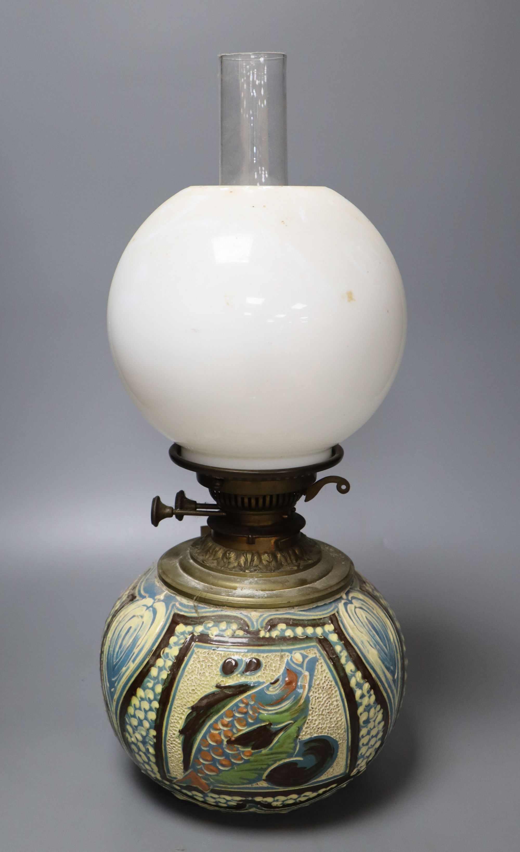 A C. H. Brannam Barum pottery oil lamp, decorated with fish, signed and dated 1899, height 50cm