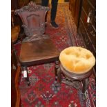A Victorian carved mahogany hall chair and a Victorian carved rosewood adjustable music stool (2)