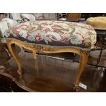 A Louis XVI style walnut dressing stool with tapestry seat, width 76cm, depth 46cm, height 50cm