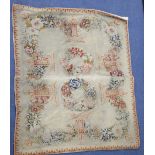 An Antique French needlepoint panel, decorated with a continuous band of flowers and two central