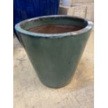 A circular green glazed garden planter, 46cm diameter, height 46cm