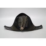 A WWI bicorn naval hat with Kings crown button