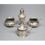 A pair of late Victorian embossed silver salts and one salt spoon, Charles Edwards, London, 1893,