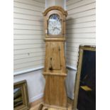 A Swedish pine longcase clock, G H Welcher, Eskilstuna, with painted dial, height 216cm