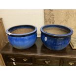 A pair of circular blue glazed garden planters, diameter 52cm, height 30cm