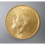 A George V 1913 gold sovereign.