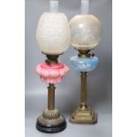 Two 19th century oil lamps, tallest 68cm including funnelCONDITION: Generally good; pink opaline