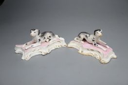 A pair of Staffordshire porcelain figures of recumbent pointers or setters, c.1835-50, 12cm