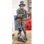 A large Goldscheider cold painted pottery figure of a gent with an umbrella, height 80cm